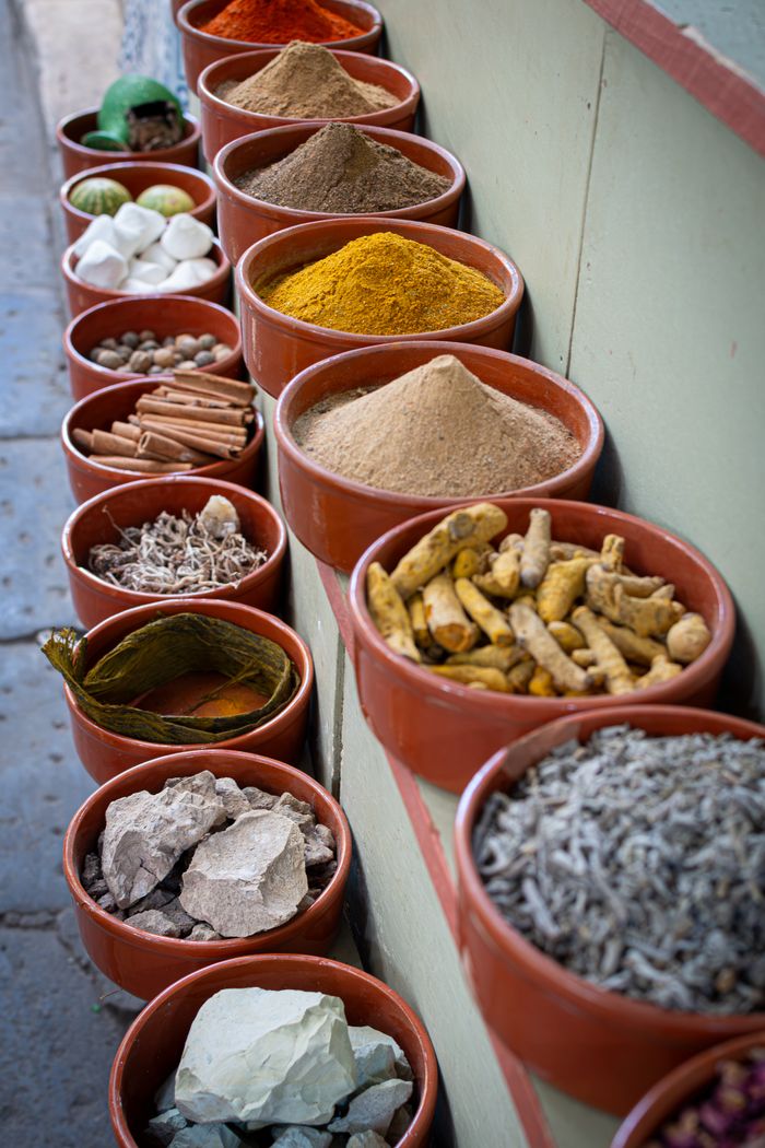 Colorful baskets of spices displayed in Tunis market souk.